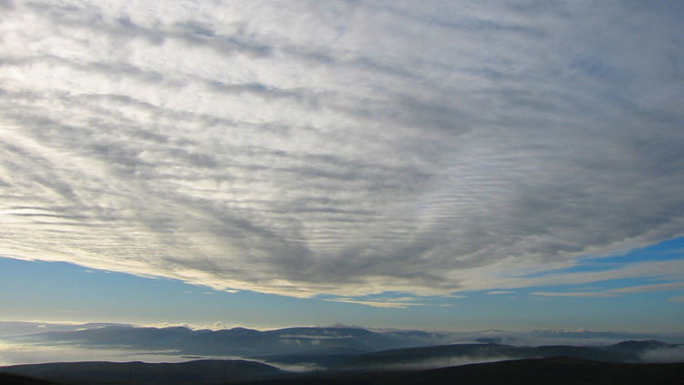 Inverted valley mist and cloud in eastern dawn sky Inverted valley mist and cloud in eastern dawn sky