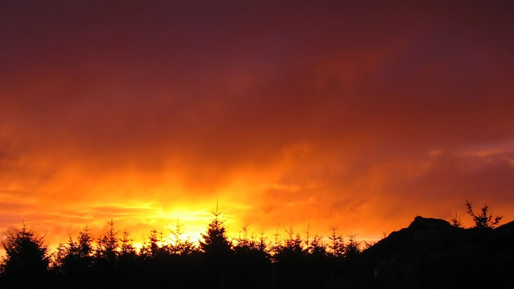 Fiery sunrise from tent pitch on Mynydd Tarw Fiery sunrise from tent pitch on Mynydd Tarw