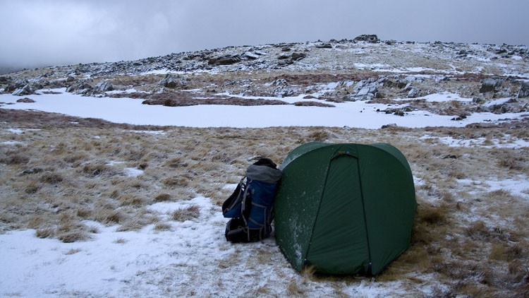 Pitch on Thunacar Knott with snow-covered tarn