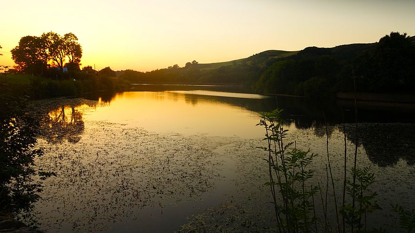 Sinking sun over Bottoms reservoir