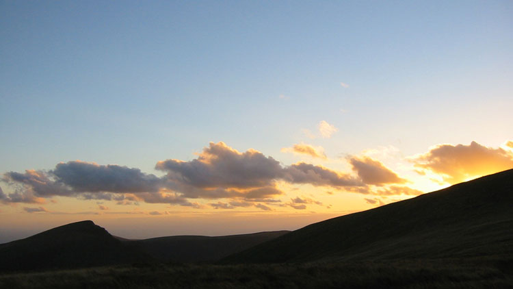 Sun descending behind Tyrrau Mawr & Craig-y-llyn