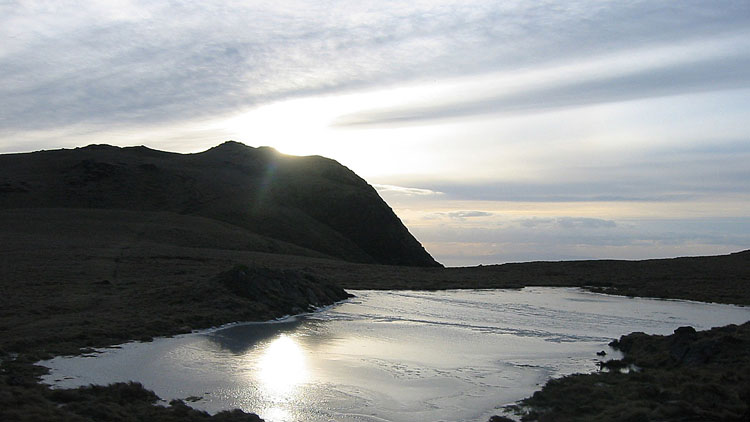 Evening sky over Whin Rigg tarn