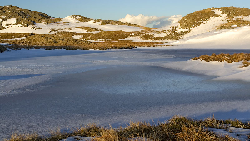 Frozen lake and rocky knolls